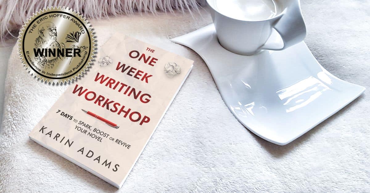 The One Week Writing Workshop book reset on a white blanket beside a coffee cup and a sticker declaring it a winner in The Eric Hoffer Book Award.